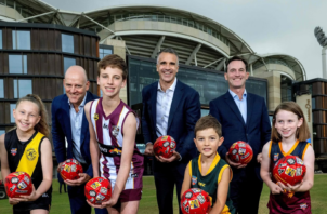 Image of AFL Chief Executive Officer Andrew Dillon, South Australian premier Peter Malinauskas and SANFL CEO Darren Chandler posing for a photo for AFL Gather Round.
